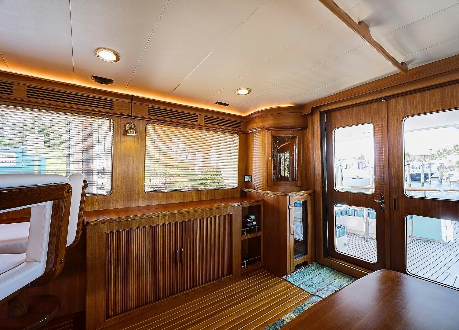 a room with wood walls and a wood floor and a wood floor aboard JOAN'S RONDEVOUS Yacht for Sale