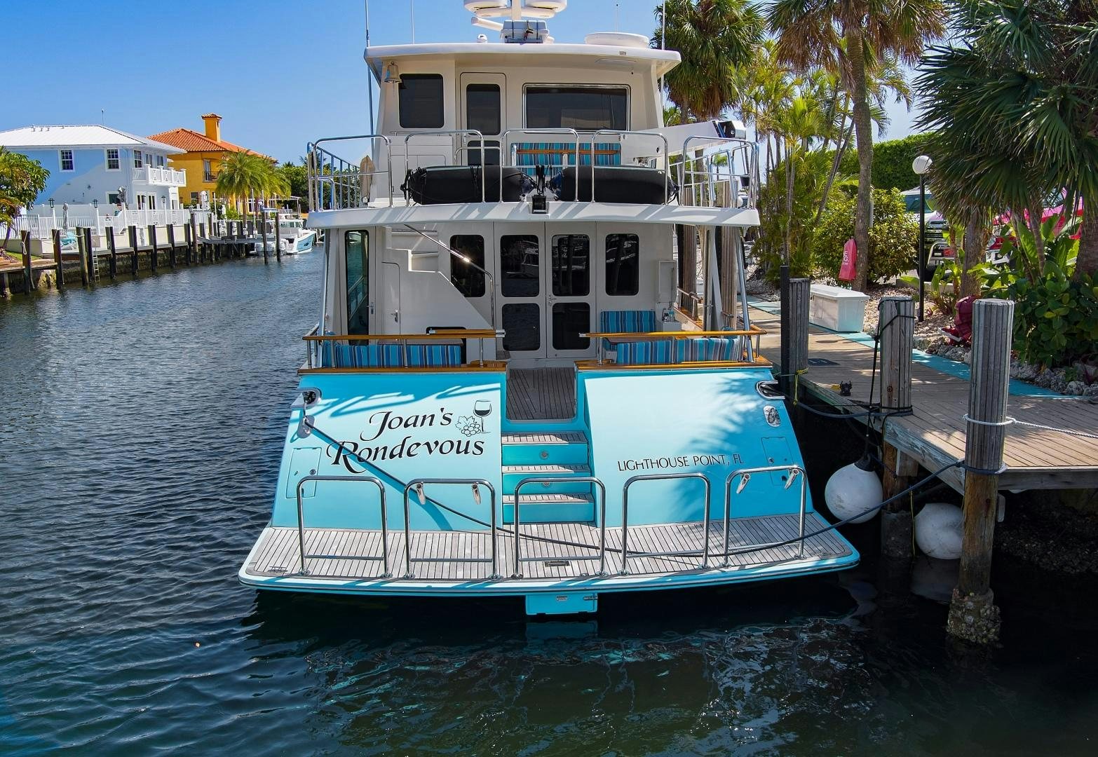 a boat docked at a pier aboard JOAN'S RONDEVOUS Yacht for Sale