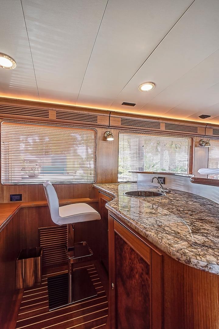 a kitchen with a sink and a microwave aboard JOAN'S RONDEVOUS Yacht for Sale