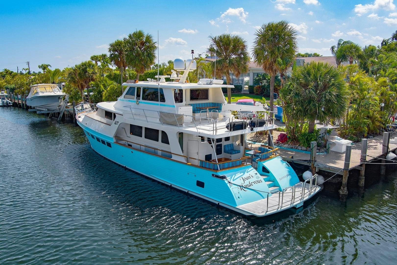 a boat docked at a pier aboard JOAN'S RONDEVOUS Yacht for Sale