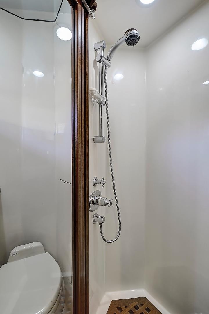 a shower with a glass door aboard JOAN'S RONDEVOUS Yacht for Sale