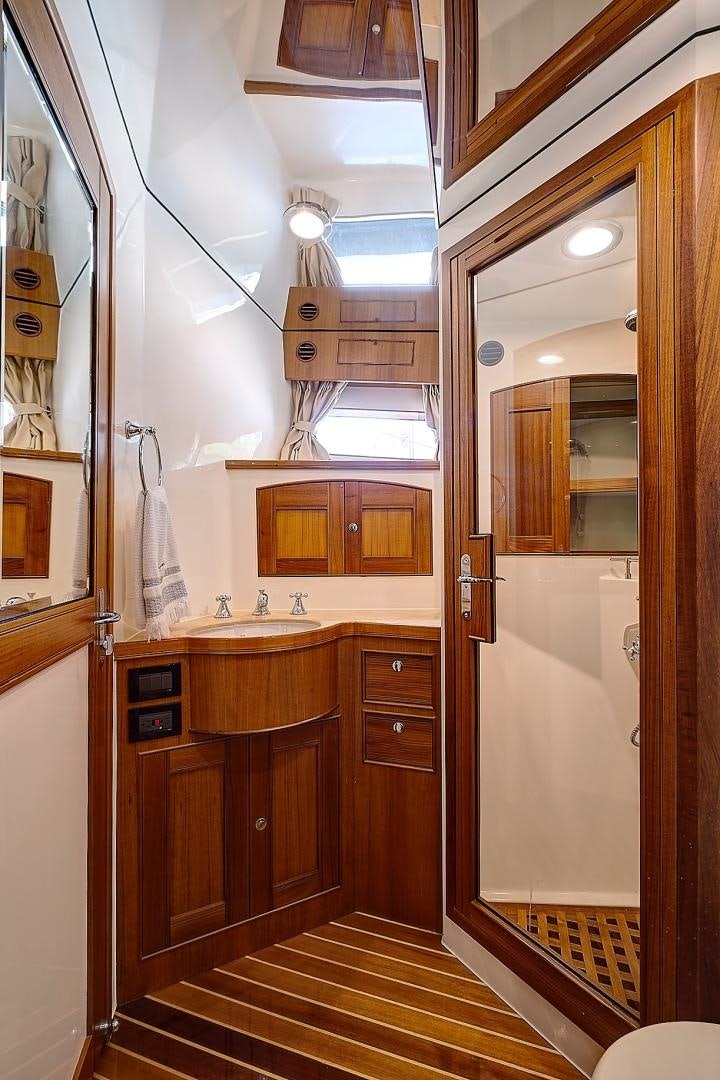 a bathroom with a sink and a mirror aboard JOAN'S RONDEVOUS Yacht for Sale