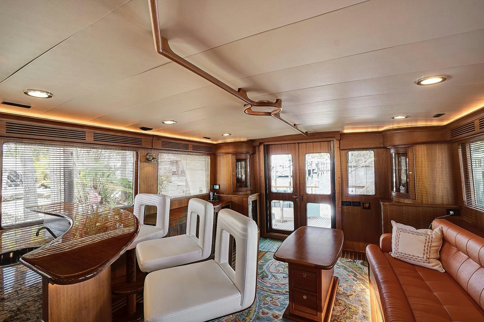 a living room with a large window aboard JOAN'S RONDEVOUS Yacht for Sale