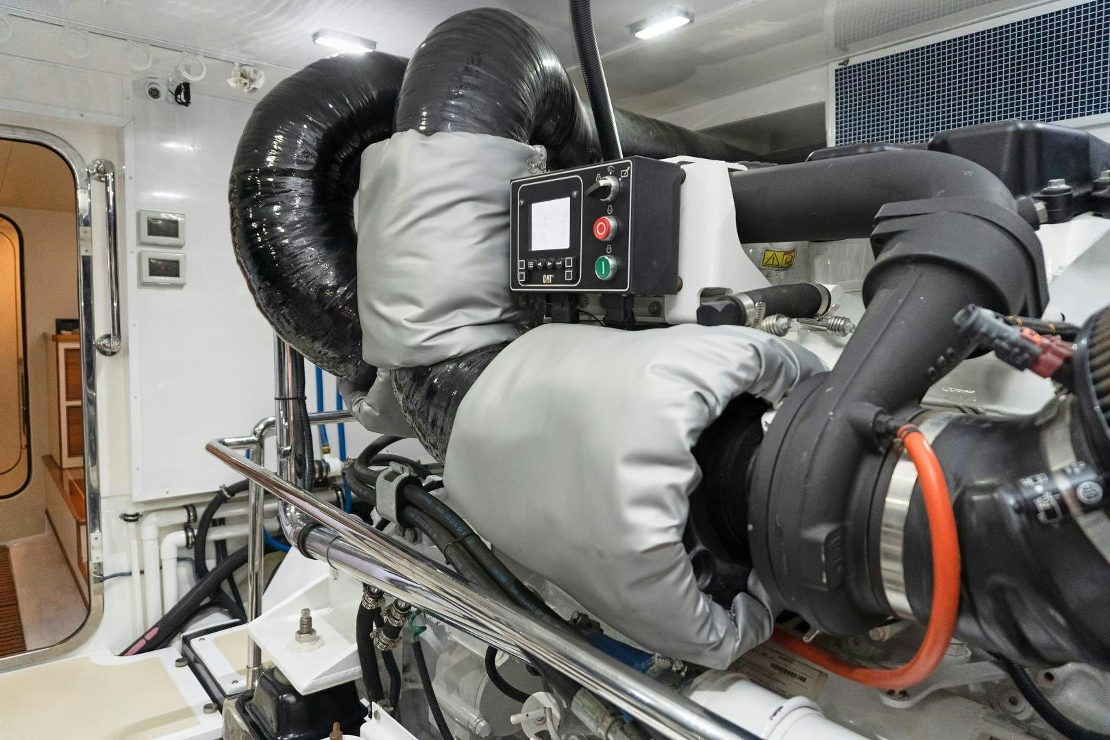 a person wearing a white helmet and holding a black steering wheel aboard JOAN'S RONDEVOUS Yacht for Sale