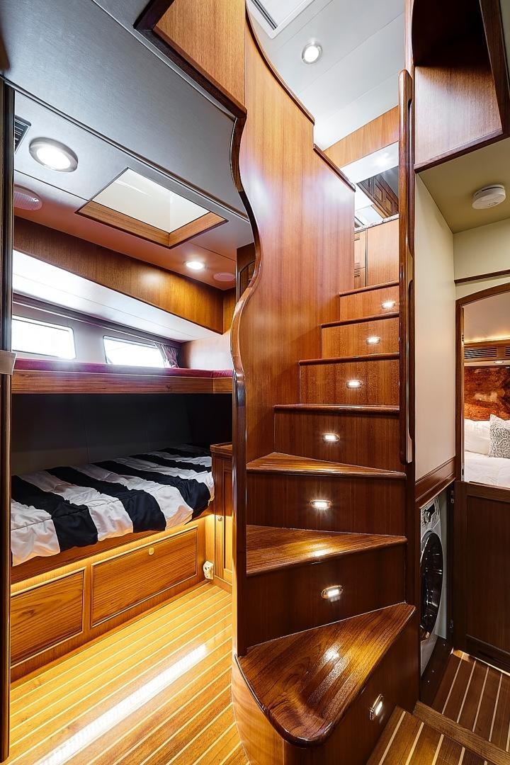 a wooden closet with a bed aboard JOAN'S RONDEVOUS Yacht for Sale