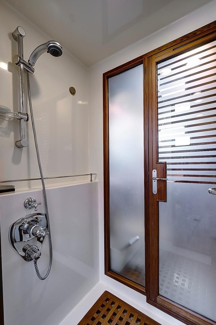 a shower with a glass door aboard JOAN'S RONDEVOUS Yacht for Sale