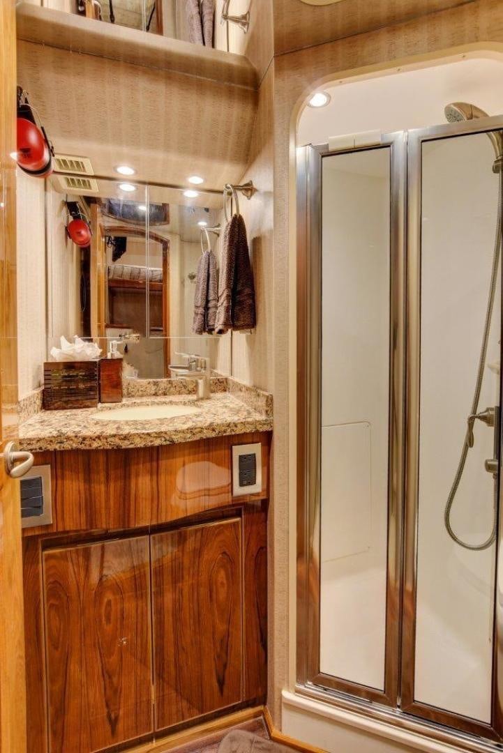 a bathroom with a large mirror aboard KICK'N Yacht for Sale