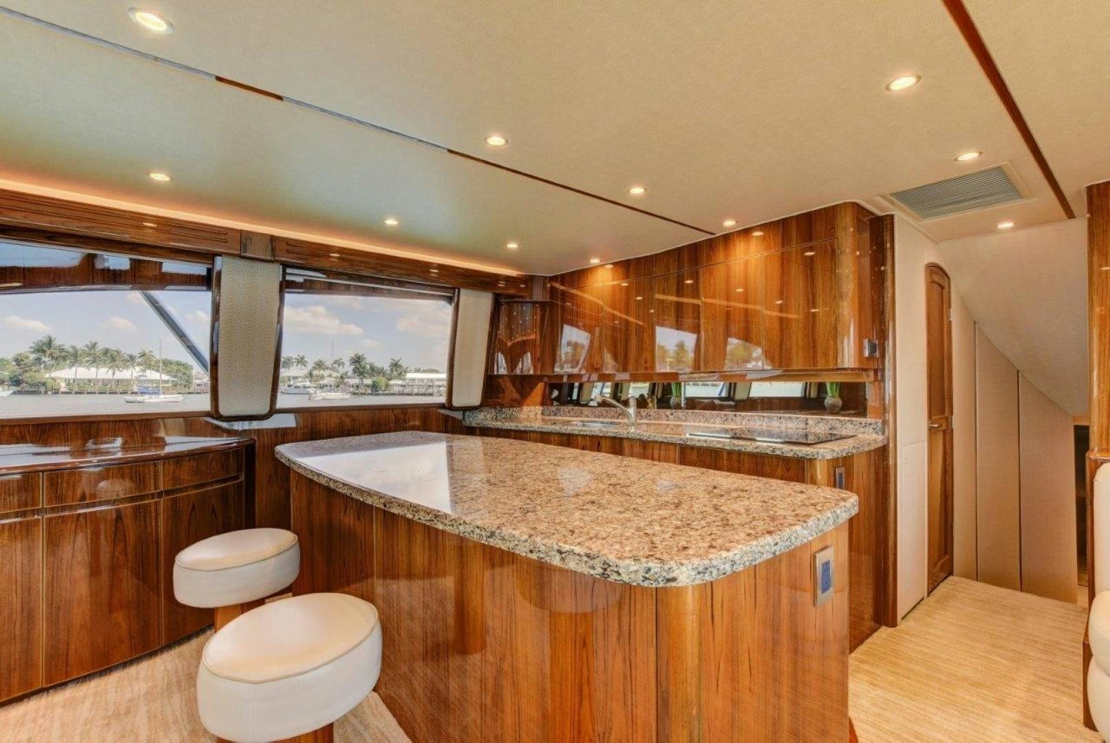 a large kitchen with a large island aboard KICK'N Yacht for Sale
