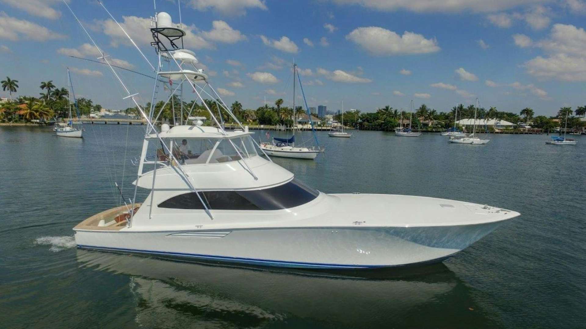 a white boat in the water aboard KICK'N Yacht for Sale