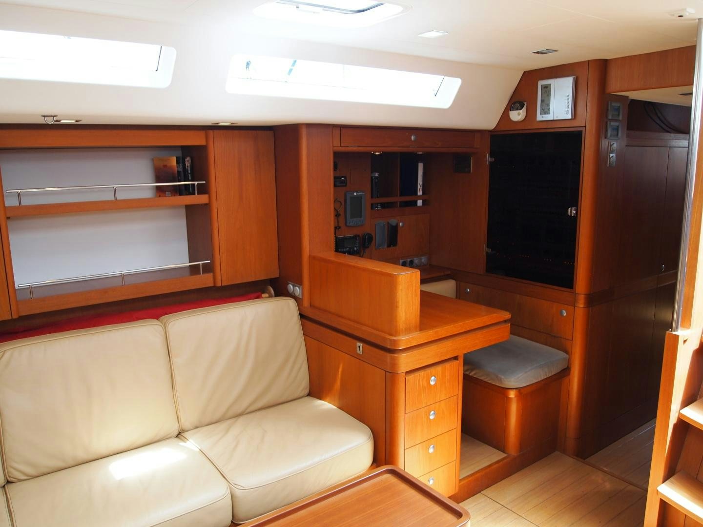 a room with a couch and a desk aboard enigma viii Yacht for Sale