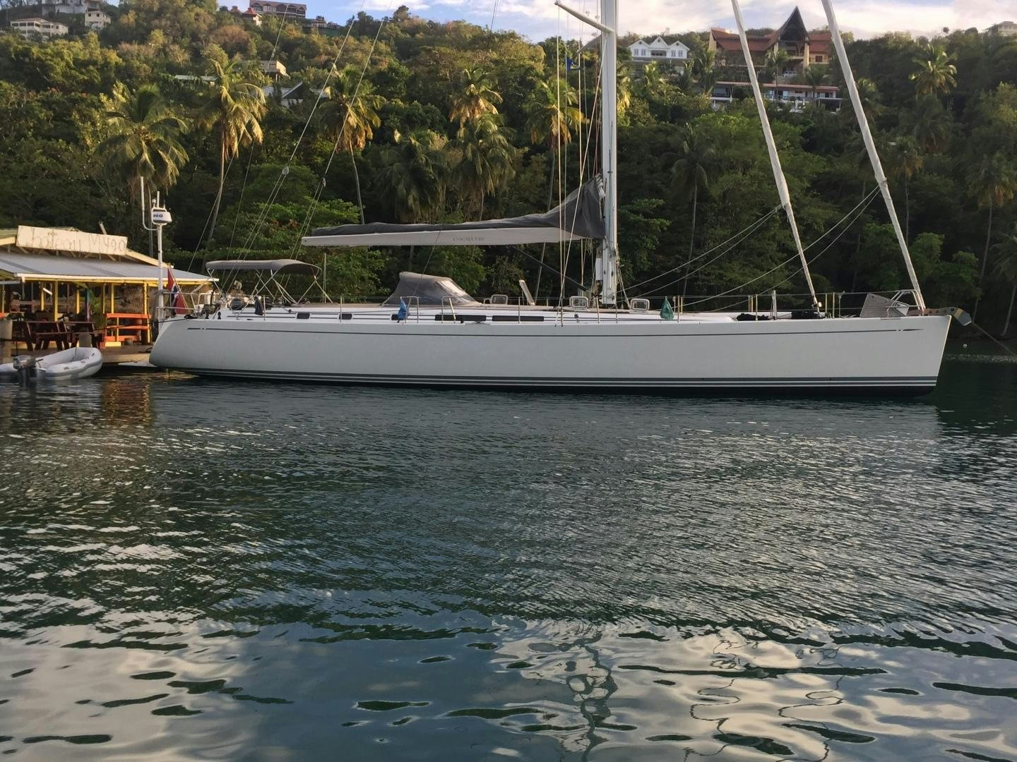 a white boat in the water aboard enigma viii Yacht for Sale
