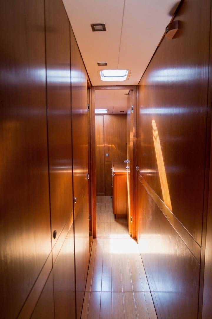a room with a few doors aboard enigma viii Yacht for Sale