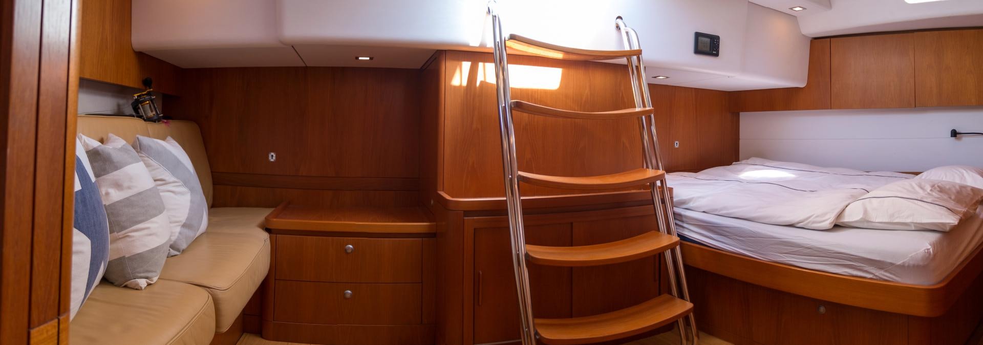 a bunk bed and a chair aboard enigma viii Yacht for Sale