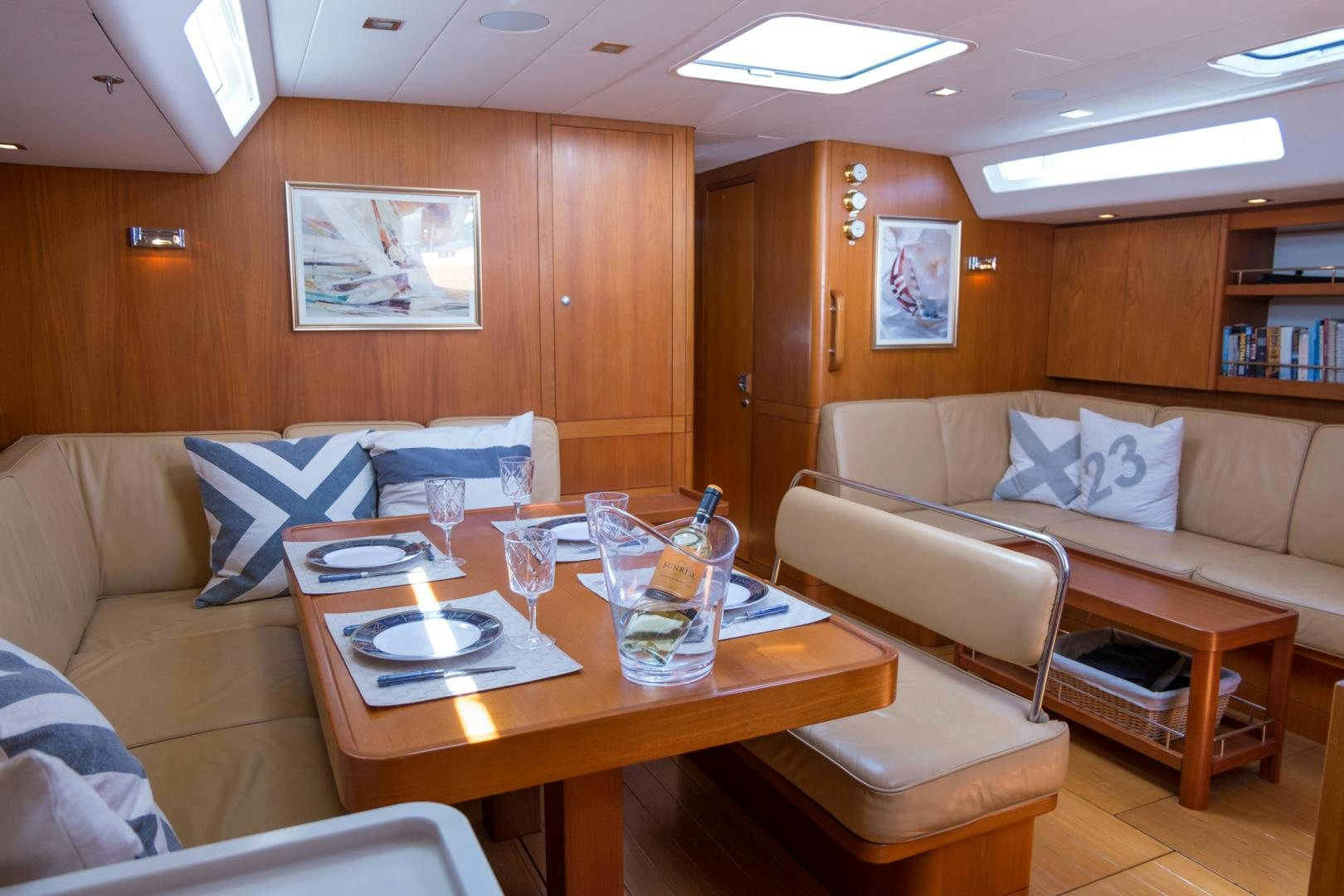 a living room with a couch and a coffee table aboard enigma viii Yacht for Sale