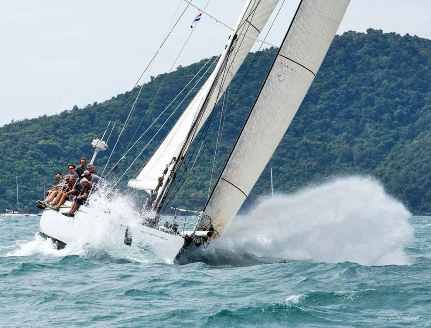 a group of people on a sailboat in the water aboard kings legend Yacht for Sale