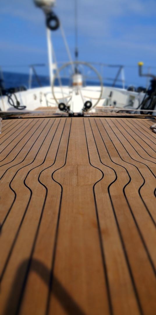 a large ship on a wooden deck aboard kings legend Yacht for Sale