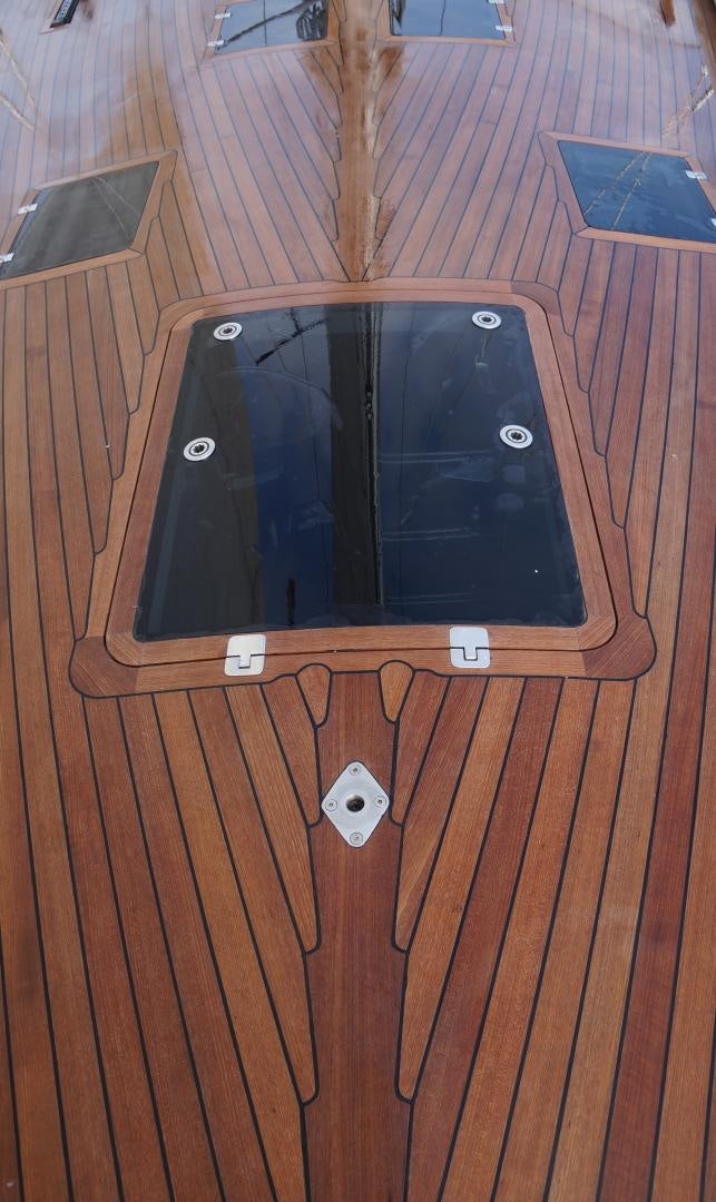a black rectangular device on a wooden surface aboard kings legend Yacht for Sale