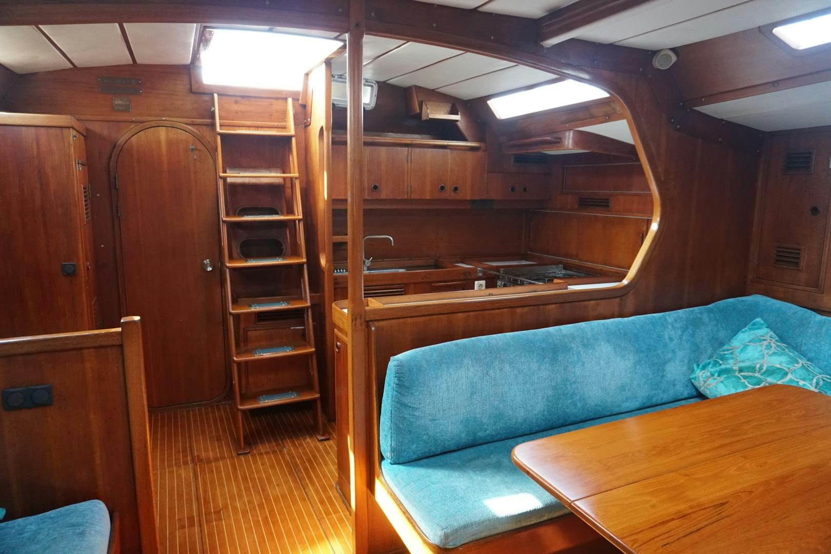 a room with a bunk bed and a table aboard kings legend Yacht for Sale