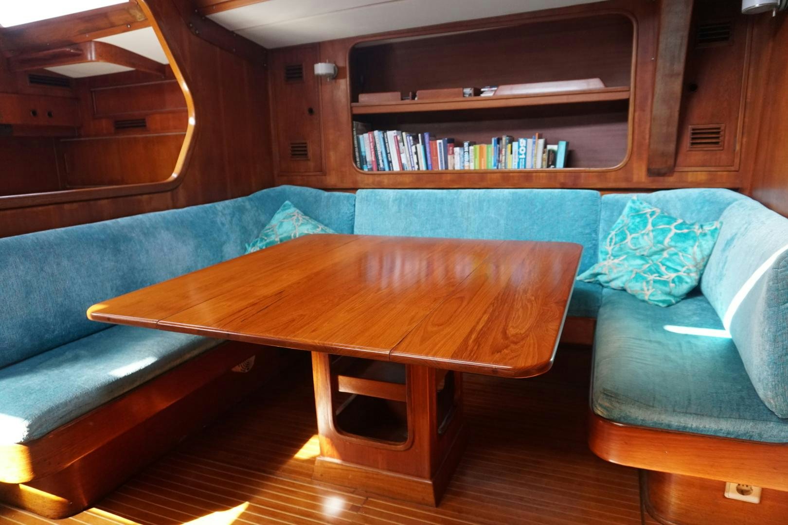a couch and a coffee table in a room aboard kings legend Yacht for Sale
