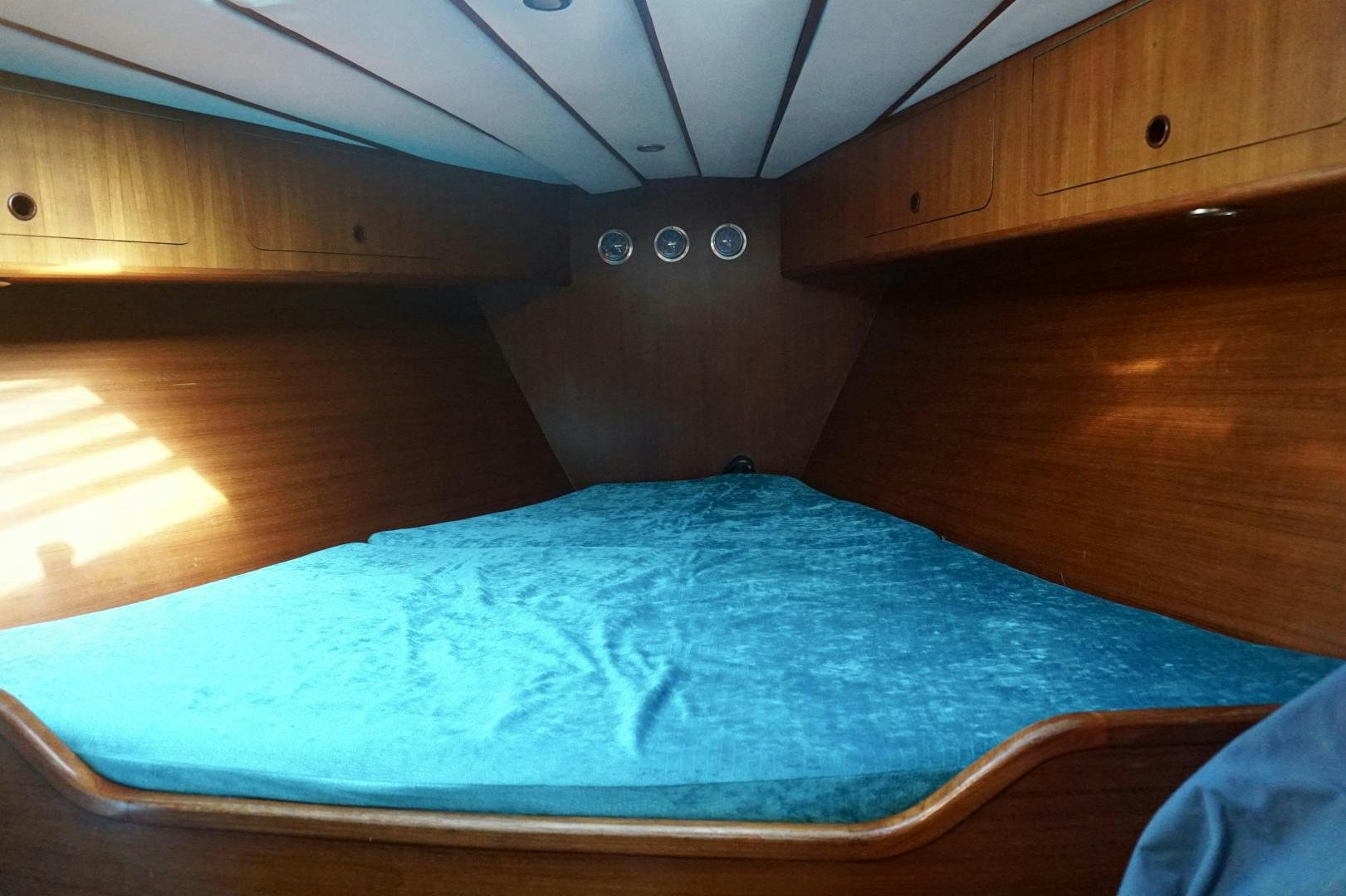 a bed in a room aboard kings legend Yacht for Sale