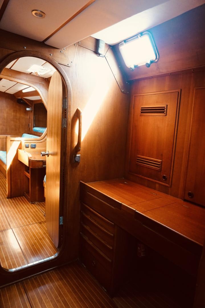 a room with wooden cabinets aboard kings legend Yacht for Sale