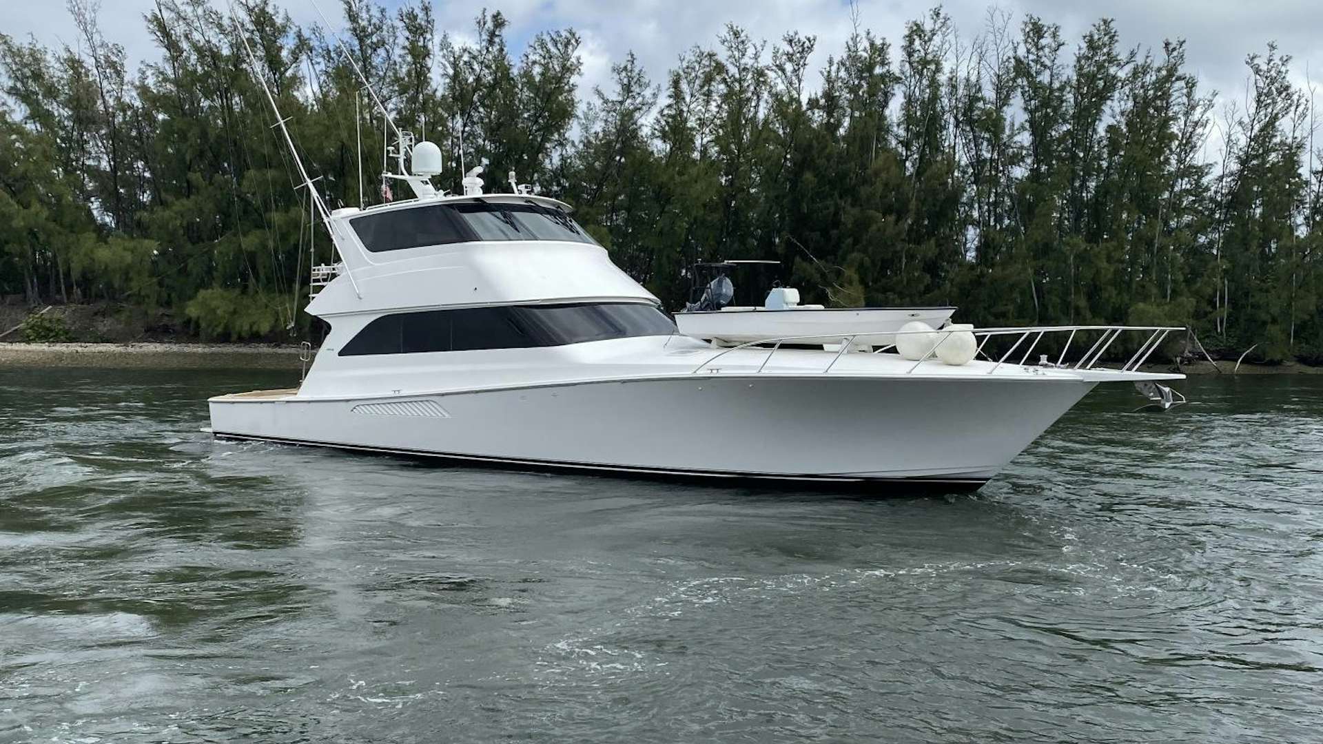 a white yacht on the water aboard PITTY Yacht for Sale