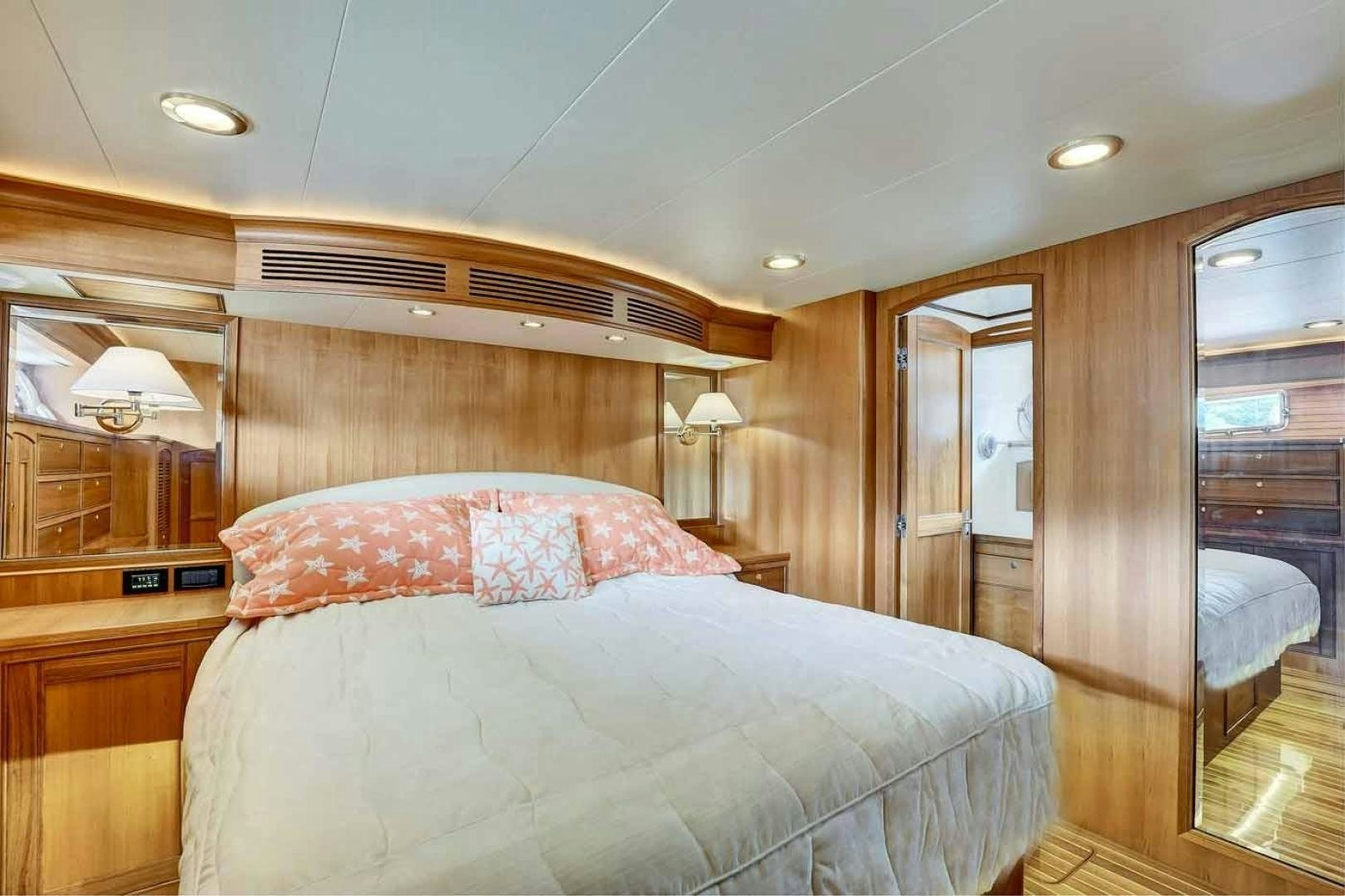 a bedroom with a bed and a closet aboard MEGUSTA Yacht for Sale