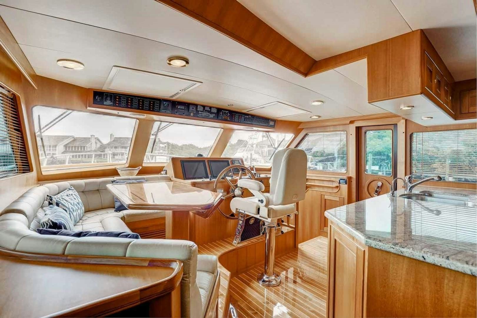 a living room with a large window aboard MEGUSTA Yacht for Sale