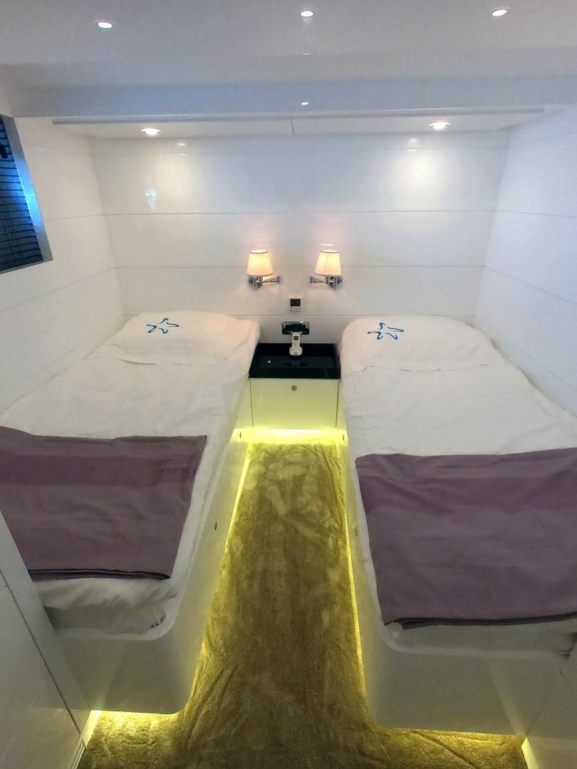 a couple of beds in a room aboard MUZO'S 20 Yacht for Sale