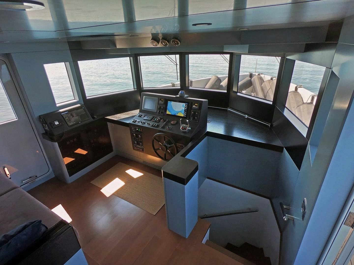 a room with a machine and a window aboard MUZO'S 20 Yacht for Sale