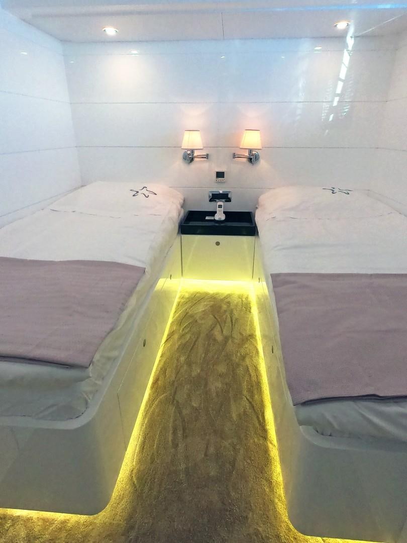a couple of beds in a room aboard MUZO'S 20 Yacht for Sale
