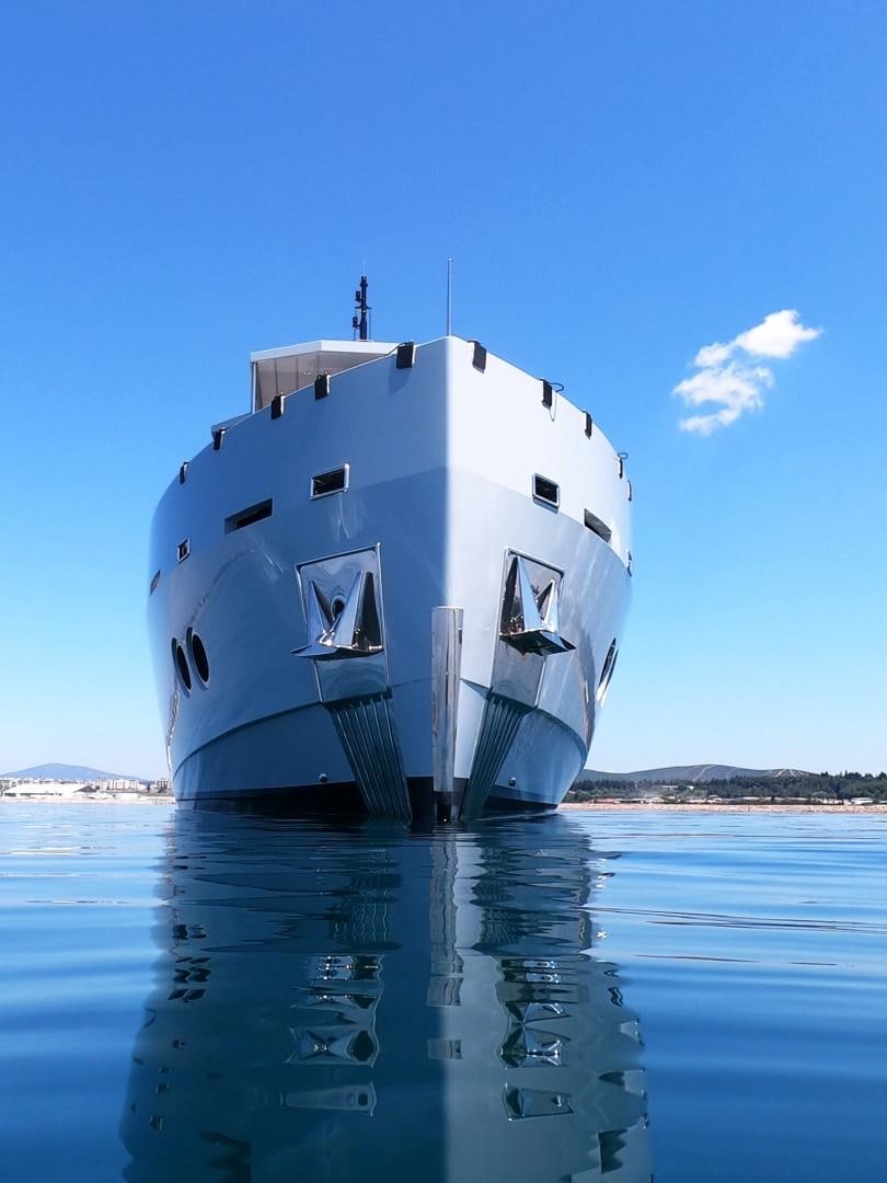 a large white ship in the water aboard MUZO'S 20 Yacht for Sale