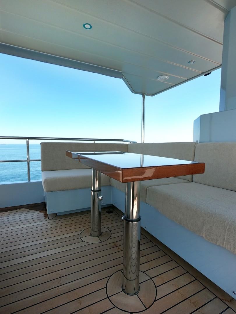 a table on a deck aboard MUZO'S 20 Yacht for Sale