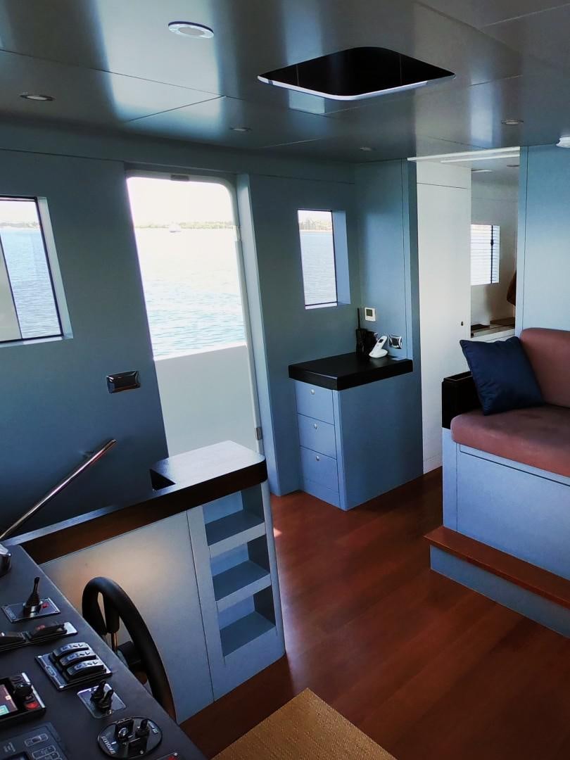 a kitchen with a sink and a couch aboard MUZO'S 20 Yacht for Sale