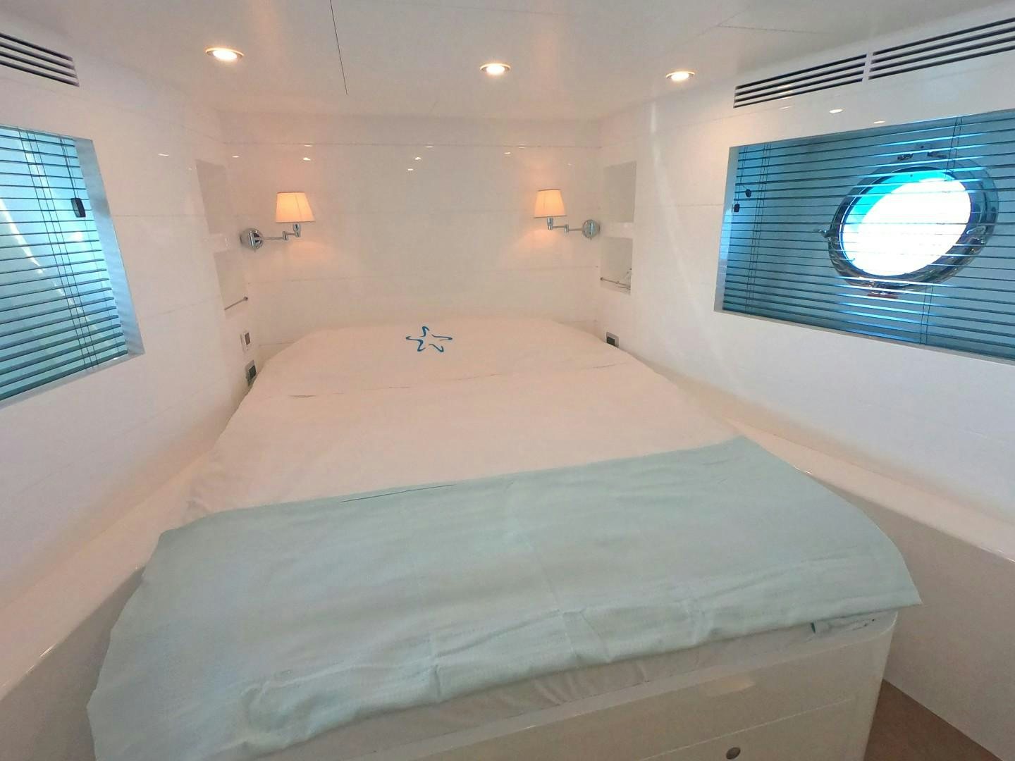 a bed with a white sheet aboard MUZO'S 20 Yacht for Sale