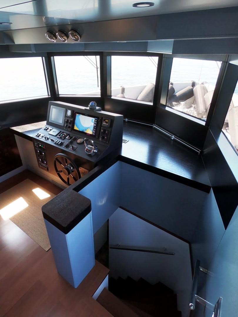a kitchen with a sink and a microwave oven aboard MUZO'S 20 Yacht for Sale