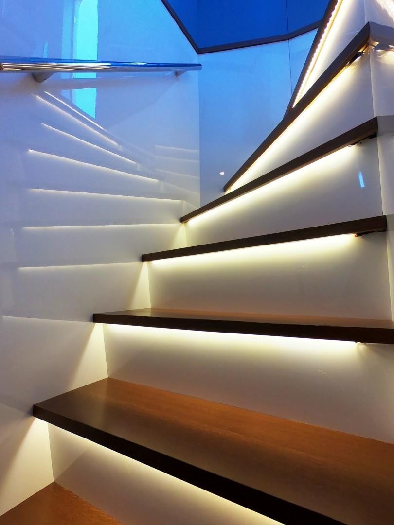 a close-up of a white staircase aboard MUZO'S 20 Yacht for Sale