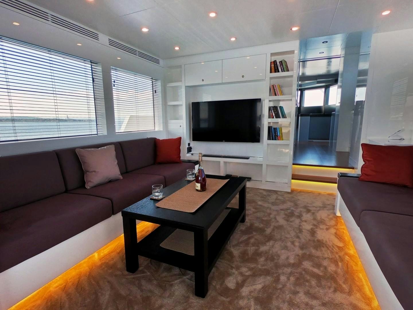 a living room with a couch and a tv aboard MUZO'S 20 Yacht for Sale