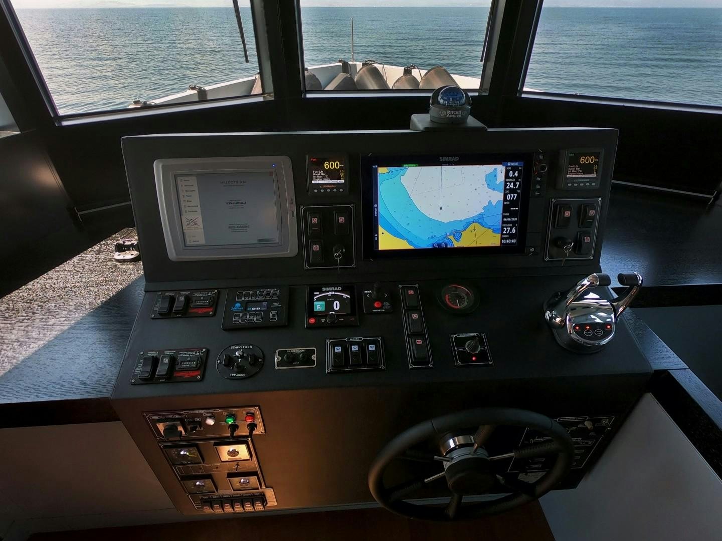 a black radio with a screen aboard MUZO'S 20 Yacht for Sale