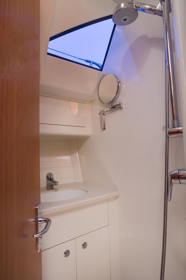 a bathroom with a shower and a sink aboard prevail Yacht for Sale