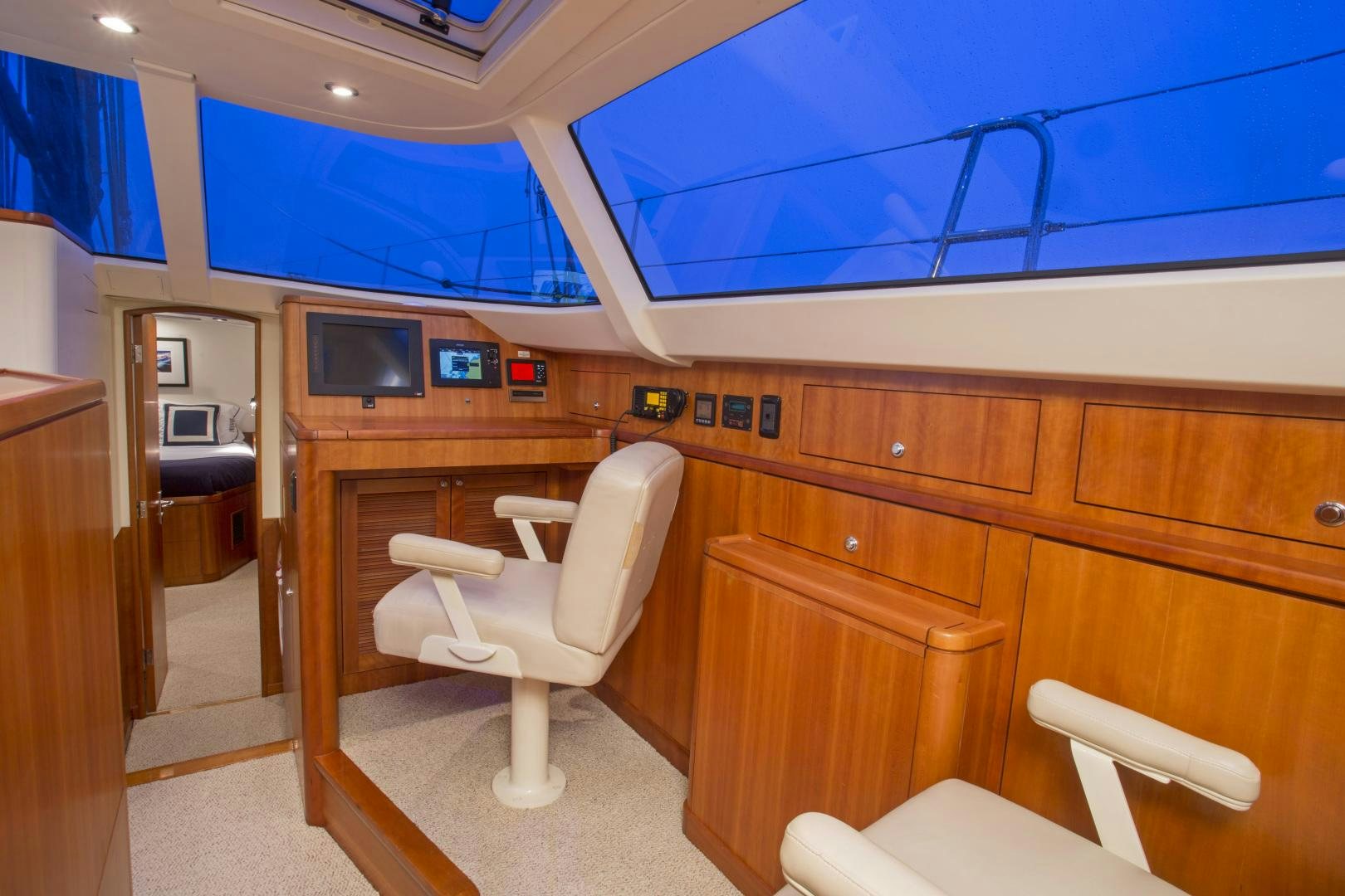 a room with a chair and desk aboard prevail Yacht for Sale