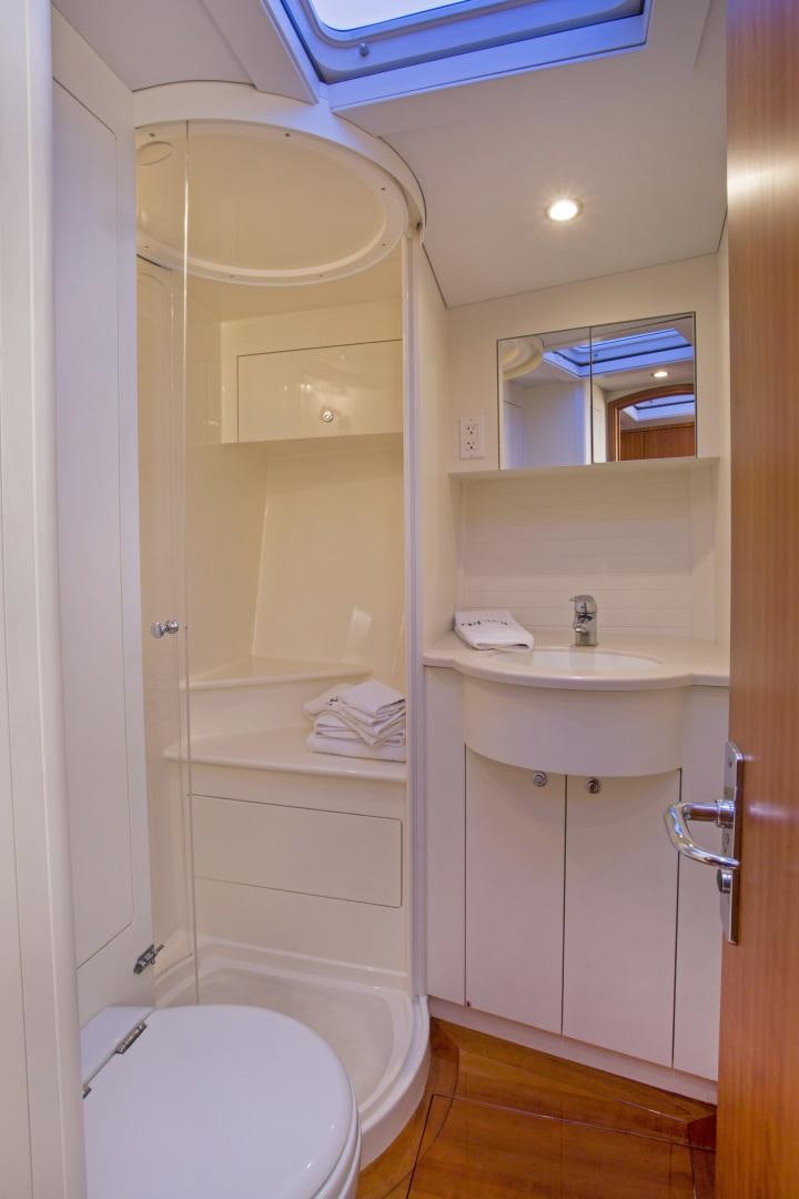 a bathroom with a toilet and sink aboard prevail Yacht for Sale