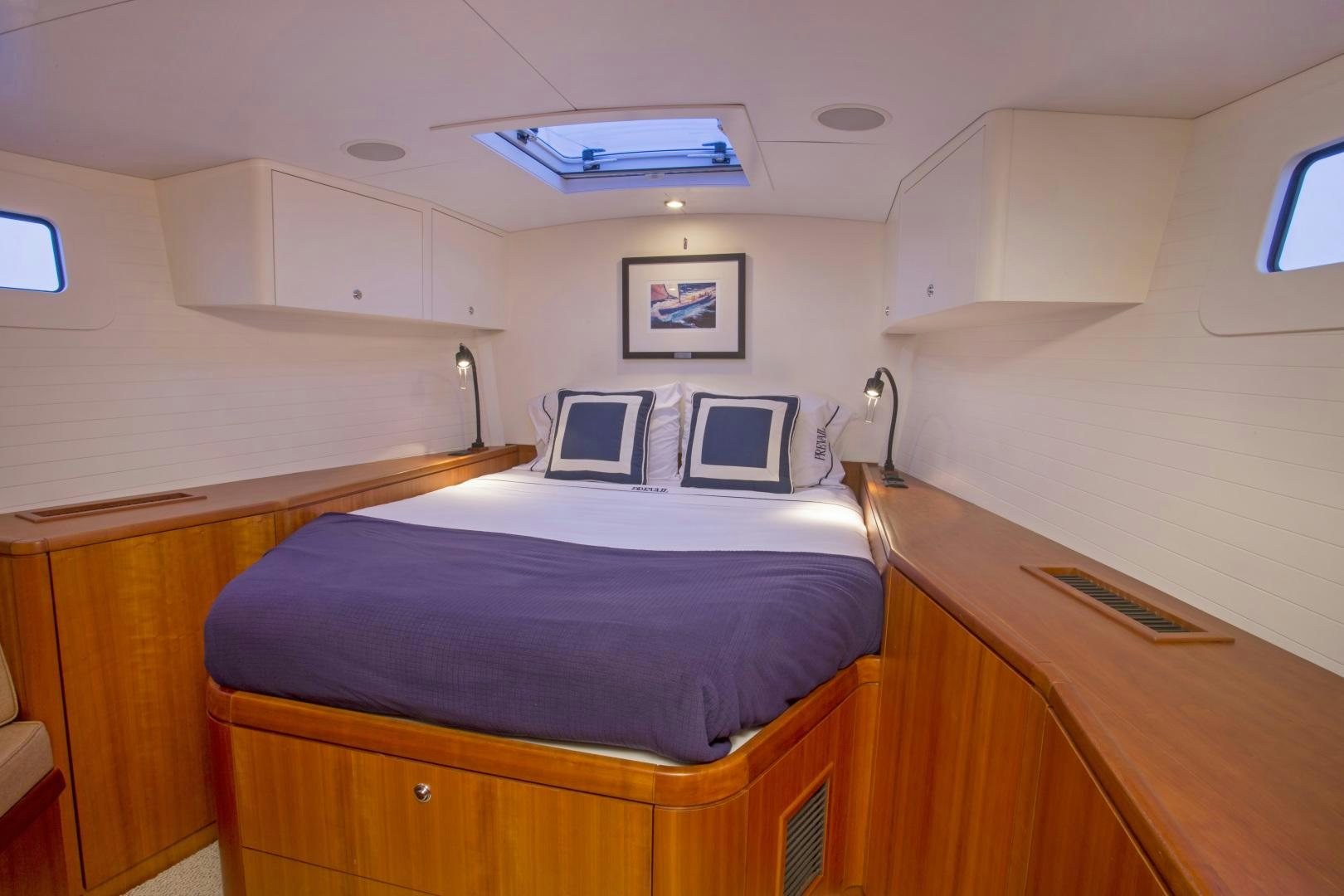 a room with two beds aboard prevail Yacht for Sale