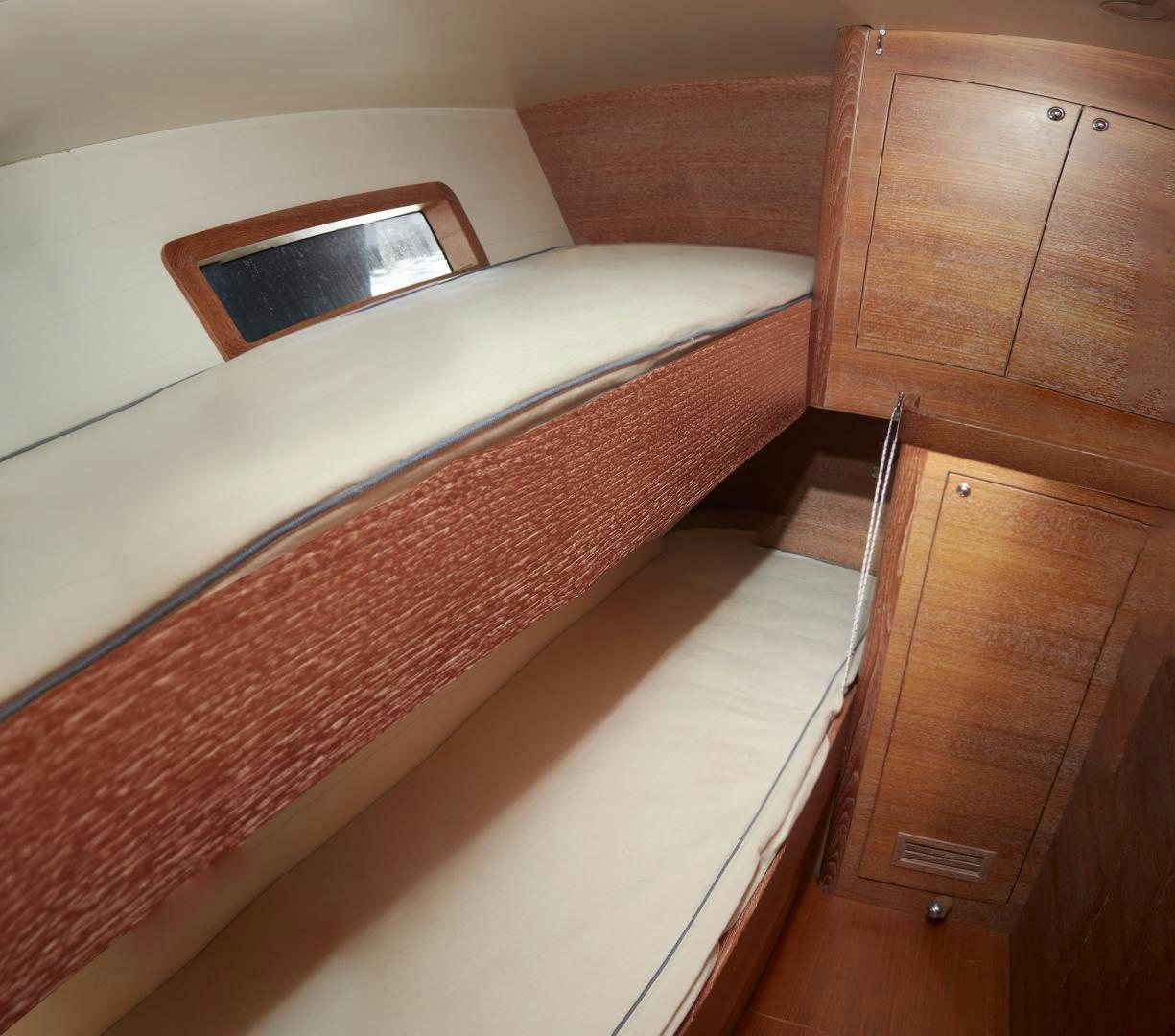 a bed with a wooden headboard aboard SPIRIT OF ALTAIR Yacht for Sale