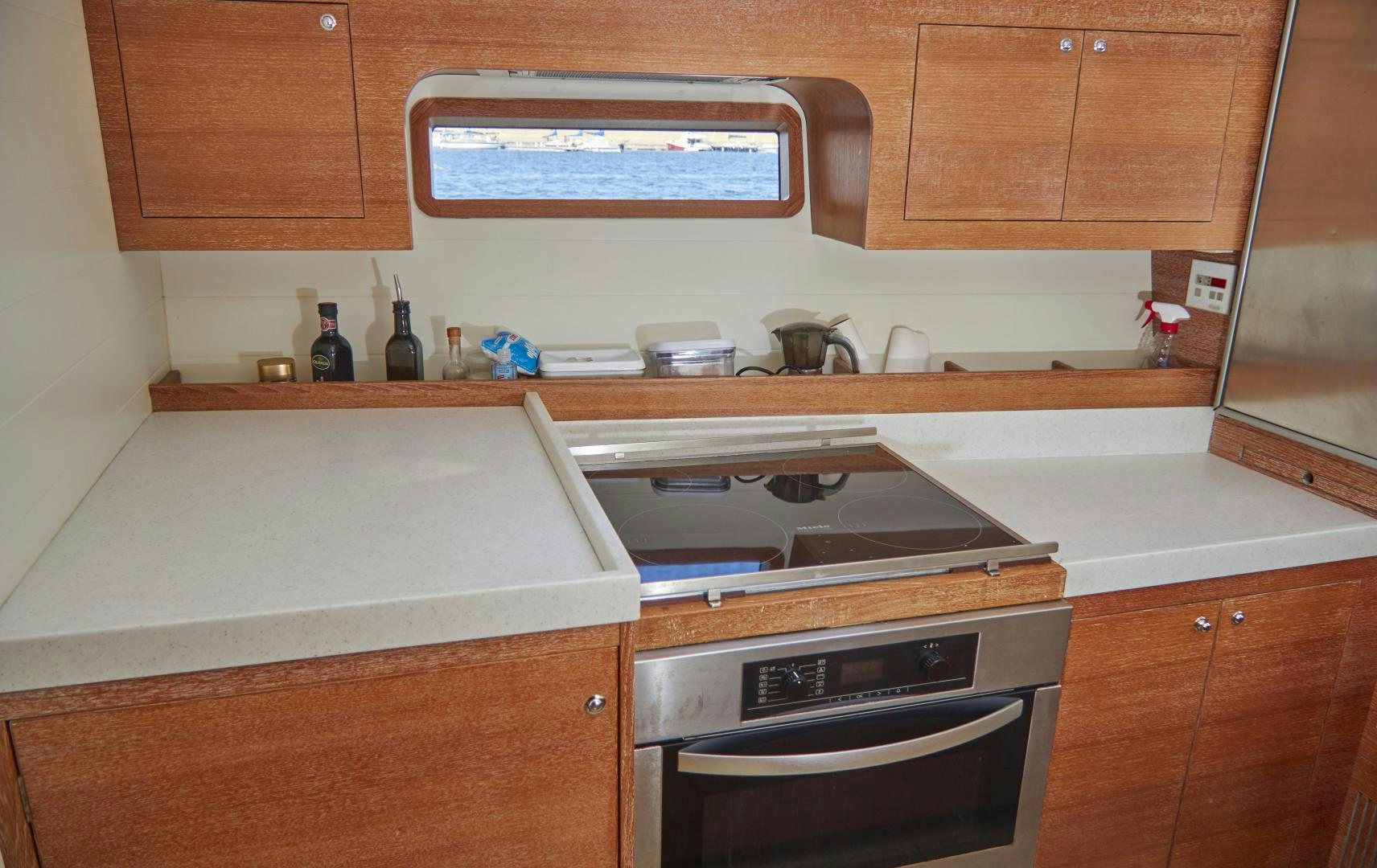 a kitchen with wooden cabinets aboard SPIRIT OF ALTAIR Yacht for Sale