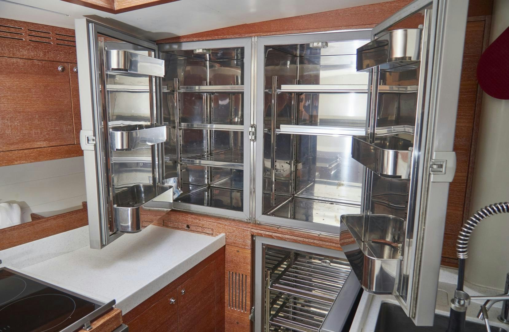 a kitchen with a glass wall aboard SPIRIT OF ALTAIR Yacht for Sale