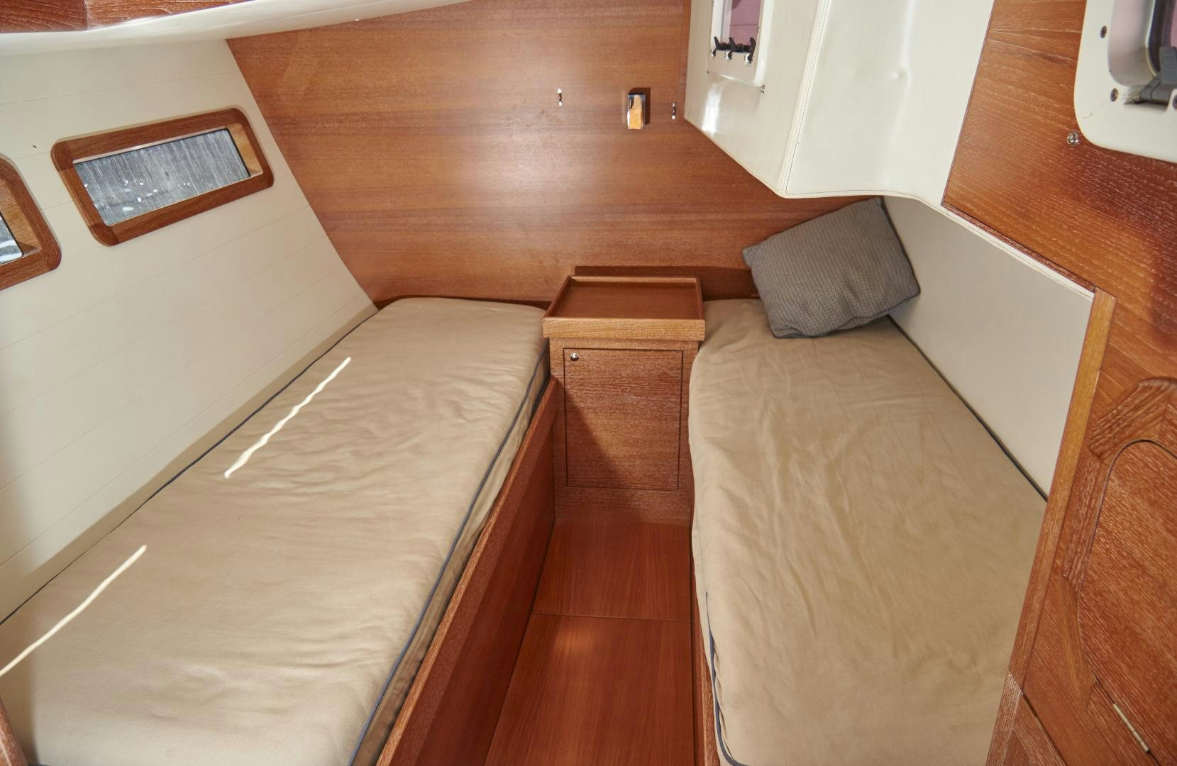 a bed with a white sheet aboard SPIRIT OF ALTAIR Yacht for Sale