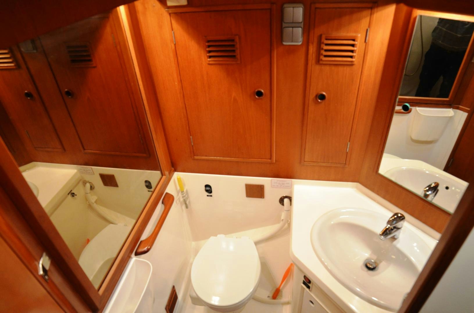 a bathroom with a tub sink and toilet aboard blue magic Yacht for Sale