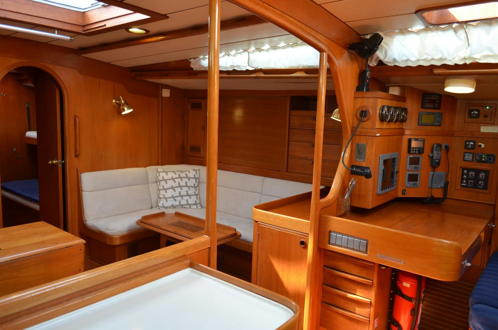 a room with a bed and a chair aboard blue magic Yacht for Sale