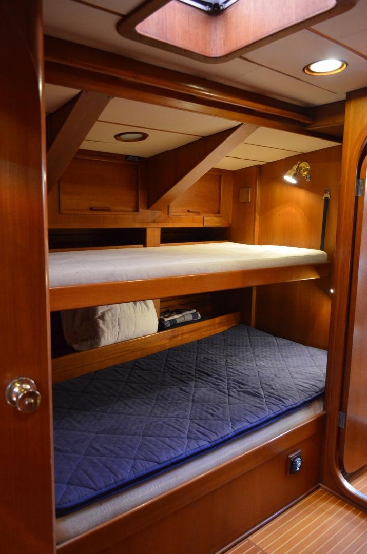 a room with a bunk bed aboard blue magic Yacht for Sale